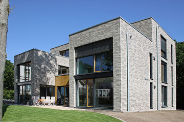 Многосемейный дом из кирпича Faro серого с оттенком, меланж