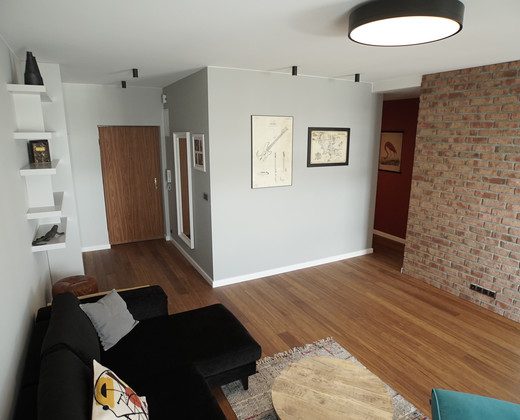 Living room with a brick wall